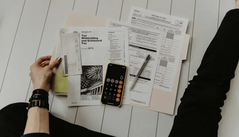 Tax paperwork with a calculator