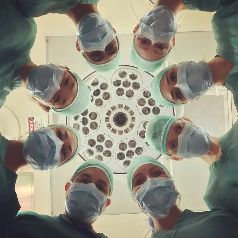 Care team gathered over a patient